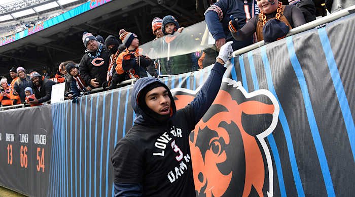 Bears wide receiver Chase Claypool (10) high-fives fans before the team’s game against the Vikings at Soldier Field.